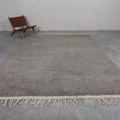 Left view of custom Moroccan taupe rug, handwoven from natural wool.
