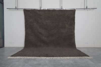 Authentic handmade dark gray Moroccan Berber rug crafted from 100% natural wool, showcasing traditional Beni Ourain weaving, ideal for modern, minimalist, and boho interiors.