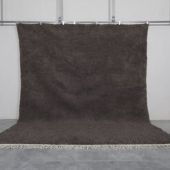 Authentic handmade dark gray Moroccan Berber rug crafted from 100% natural wool, showcasing traditional Beni Ourain weaving, ideal for modern, minimalist, and boho interiors.