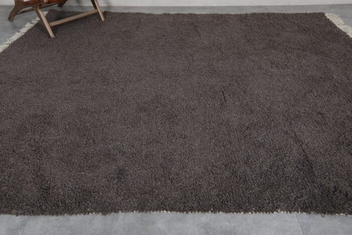 Moroccan dark gray wool rug, hand-knotted with care by skilled Berber women, customizable and timeless.