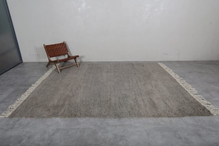 Right side of Moroccan taupe wool rug, showcasing plush texture and minimalist style.