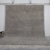 Handmade Moroccan taupe wool rug with Beni Ourain design and soft texture.
