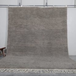 Handmade Moroccan taupe wool rug with Beni Ourain design and soft texture.