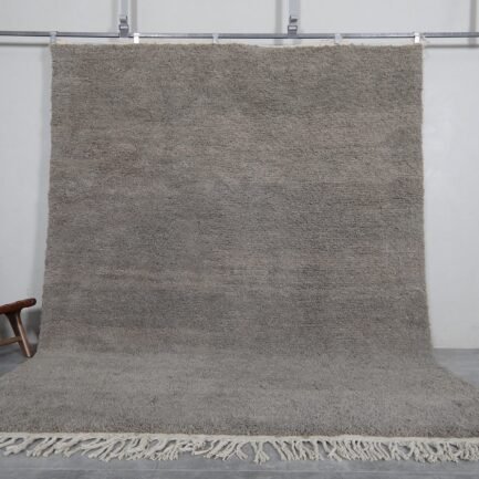 Handmade Moroccan taupe wool rug with Beni Ourain design and soft texture.