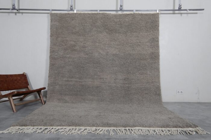 Handmade Moroccan taupe wool rug with Beni Ourain design and soft texture.