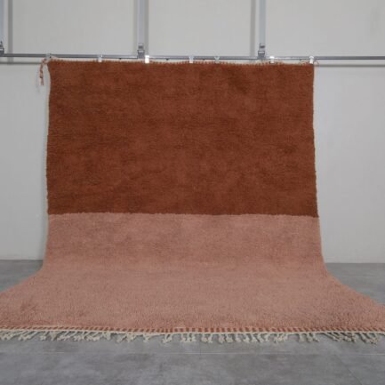 Handmade Moroccan Beni Ourain rug in warm rust and tan tones, crafted from 100% genuine lamb wool with soft and thick texture.