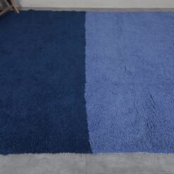 Moroccan wool rug in cobalt and light blue, revealing thickness, quality, and handwoven detail.