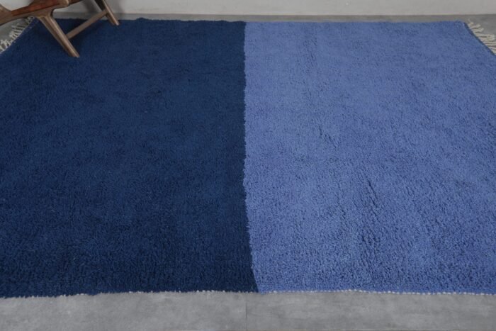 Moroccan wool rug in cobalt and light blue, revealing thickness, quality, and handwoven detail.