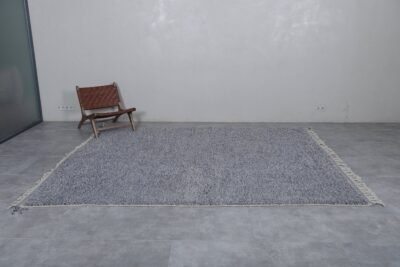 Moroccan charcoal gray wool rug showcasing its solid tone and soft, handwoven texture by Berber artisans