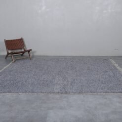Moroccan charcoal gray wool rug showcasing its solid tone and soft, handwoven texture by Berber artisans