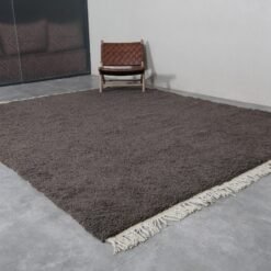 handmade Beni Ourain dark gray rug from Morocco, featuring deep neutral tones and soft, dense wool pile for stylish floor layering
