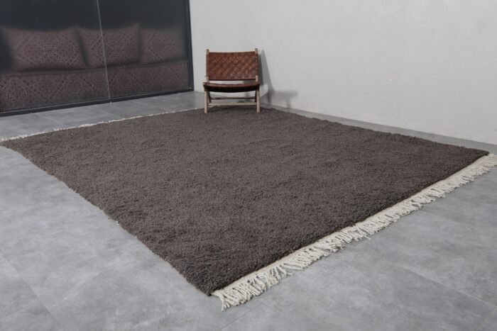 handmade Beni Ourain dark gray rug from Morocco, featuring deep neutral tones and soft, dense wool pile for stylish floor layering