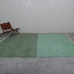Moroccan green and pistachio wool rug, highlighting artisan craftsmanship.