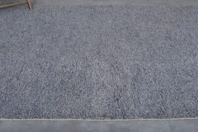 minimalist charcoal Moroccan rug with dense wool fibers and a deep, rich tone.