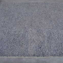 minimalist charcoal Moroccan rug with dense wool fibers and a deep, rich tone.
