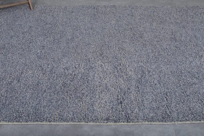 minimalist charcoal Moroccan rug with dense wool fibers and a deep, rich tone.