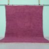 Handmade Moroccan plum wool rug with soft texture and solid Beni Ourain design.