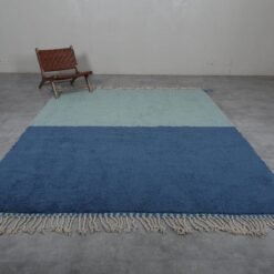 handmade Moroccan Berber rug in blue and pistachio, showing high-pile wool texture and detailed weaving.