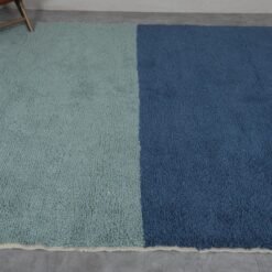 handmade Moroccan rug in pistachio and blue, showing wool thickness, backing, and expert knotting.