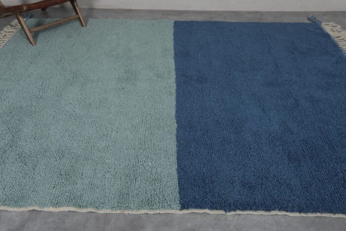 handmade Moroccan rug in pistachio and blue, showing wool thickness, backing, and expert knotting.