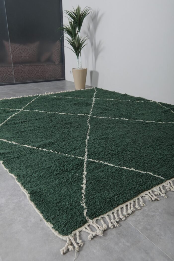 custom Moroccan rug in dark green, emphasizing the rug's plush wool surface and deep, calming color tones.