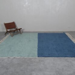 Beni Ourain rug in soft pistachio and blue, showcasing its plush surface and modern Moroccan aesthetic.