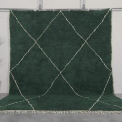 Handmade Moroccan rug in solid dark green, woven from 100% natural lamb wool by Berber artisans, featuring an optional trellis-style Beni Ourain pattern for a rich, earthy interior accent.