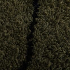 Macro shot highlighting dense lamb wool fibers and rich texture of dark green and black handmade Moroccan rug.