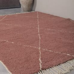 chestnut Moroccan rug with ivory pattern, showing its thickness, quality weave, and authentic handmade origin.