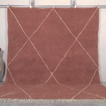 Handmade Moroccan rug featuring a rich chestnut brown base with an elegant ivory trellis pattern, crafted by Berber artisans using 100% genuine lamb wool in the traditional Beni Ourain style.