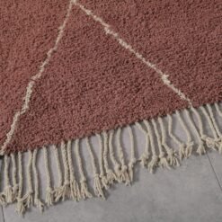 fringe finishing on a hand-knotted Moroccan rug in chestnut and ivory, reflecting the attention to detail and artisan quality.