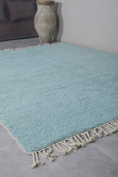 flat lay of a solid turquoise Beni Ourain rug, handwoven in Morocco using natural wool, ideal for bold, modern, or coastal interiors.