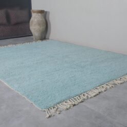 Turquoise Moroccan rug texture, showcasing thick handwoven wool fibers and soft pile perfect for living spaces.