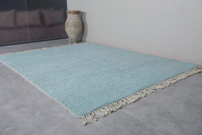 Turquoise Moroccan rug texture, showcasing thick handwoven wool fibers and soft pile perfect for living spaces.