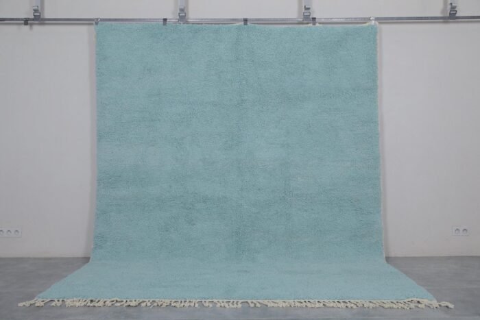 handmade turquoise Moroccan rug showing clean edge finishes, thick wool texture, and the rich color inspired by Mediterranean waters.