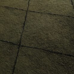 handmade Berber rug in deep green with black trellis pattern, highlighting fine weaving and natural lamb wool fibers.