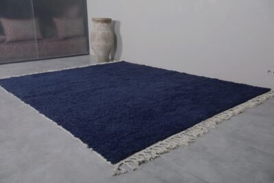 Moroccan cobalt blue rug showcasing the dense wool fibers, soft texture, and rich solid color, ideal for adding warmth and style to any home decor.