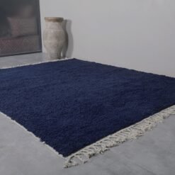 Moroccan cobalt blue rug showcasing the dense wool fibers, soft texture, and rich solid color, ideal for adding warmth and style to any home decor.