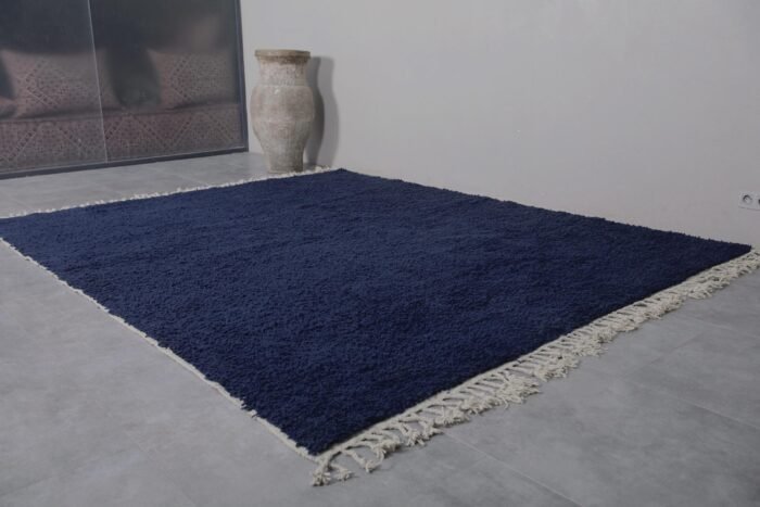 Moroccan cobalt blue rug showcasing the dense wool fibers, soft texture, and rich solid color, ideal for adding warmth and style to any home decor.