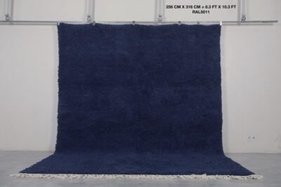 Moroccan cobalt blue wool rug, highlighting its hand-knotted pile and authentic Berber weaving from the Atlas Mountains.
