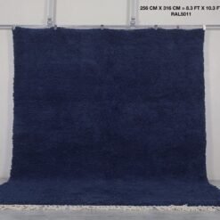 Moroccan cobalt blue wool rug, highlighting its hand-knotted pile and authentic Berber weaving from the Atlas Mountains.