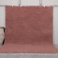 Handmade Moroccan rust brown Beni Ourain rug crafted with 100% natural lamb wool, featuring a rich, earthy solid color and a plush shag texture, perfect for adding warmth and elegance to modern or rustic interiors.