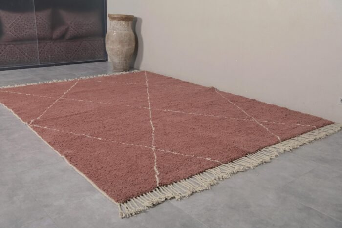 Moroccan chestnut wool rug with ivory trellis design, highlighting the dense texture, hand-knotting details, and authentic Berber craftsmanship.