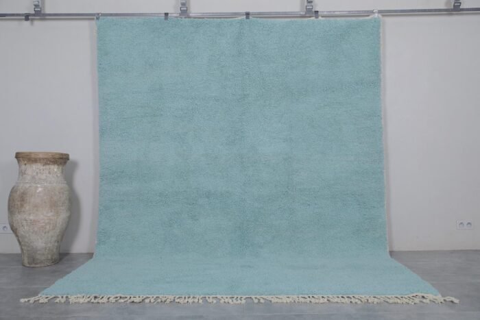 Handmade Moroccan Beni Ourain rug in vibrant turquoise, crafted from 100% natural wool by Berber artisans. A bold, luxurious wool area rug perfect for boho, coastal, or modern interiors.