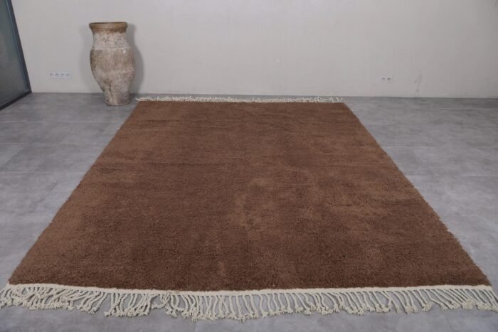 custom brown Beni Ourain rug, highlighting hand-knotting craftsmanship and natural material in a warm earthy tone.