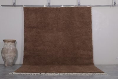 Authentic handmade Moroccan Beni Ourain rug in solid brown, woven from 100% lamb’s wool by Berber artisans. A timeless wool area rug for earthy, modern, or rustic interiors.
