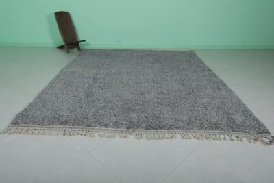 authentic handmade Moroccan gray wool rug with classic Beni Ourain tribal patterns, highlighting the dense, natural wool fibers and traditional craftsmanship.