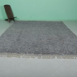 authentic handmade Moroccan gray wool rug with classic Beni Ourain tribal patterns, highlighting the dense, natural wool fibers and traditional craftsmanship.