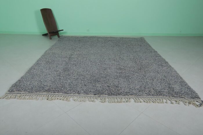 authentic handmade Moroccan gray wool rug with classic Beni Ourain tribal patterns, highlighting the dense, natural wool fibers and traditional craftsmanship.