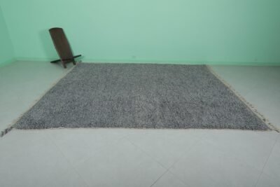 handmade Moroccan gray wool rug featuring Beni Ourain tribal motifs, showcasing the soft, plush texture and the high-quality natural wool material used by Moroccan artisans.